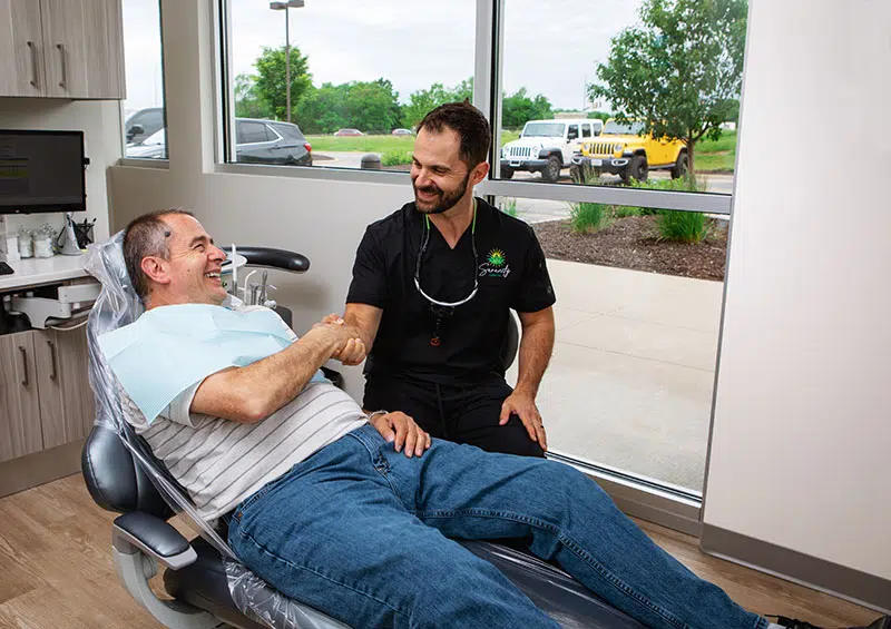 Dr. Silva with a dental patient at Serenity Dental in Olathe, KS