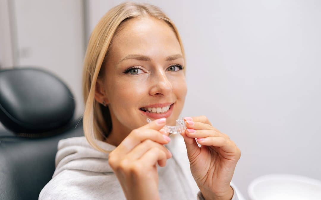 woman trying invisible dental aligners at serenity dental